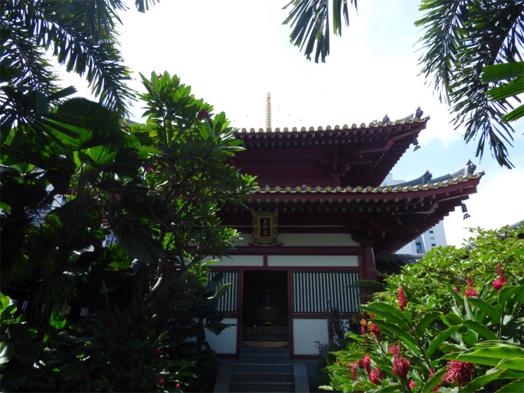 A small temple construction in the midsts of different plants